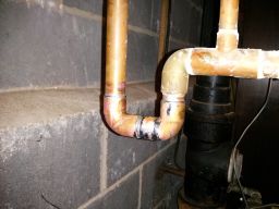 The newly soldered plumbing connection I just made in my Mom's basement.